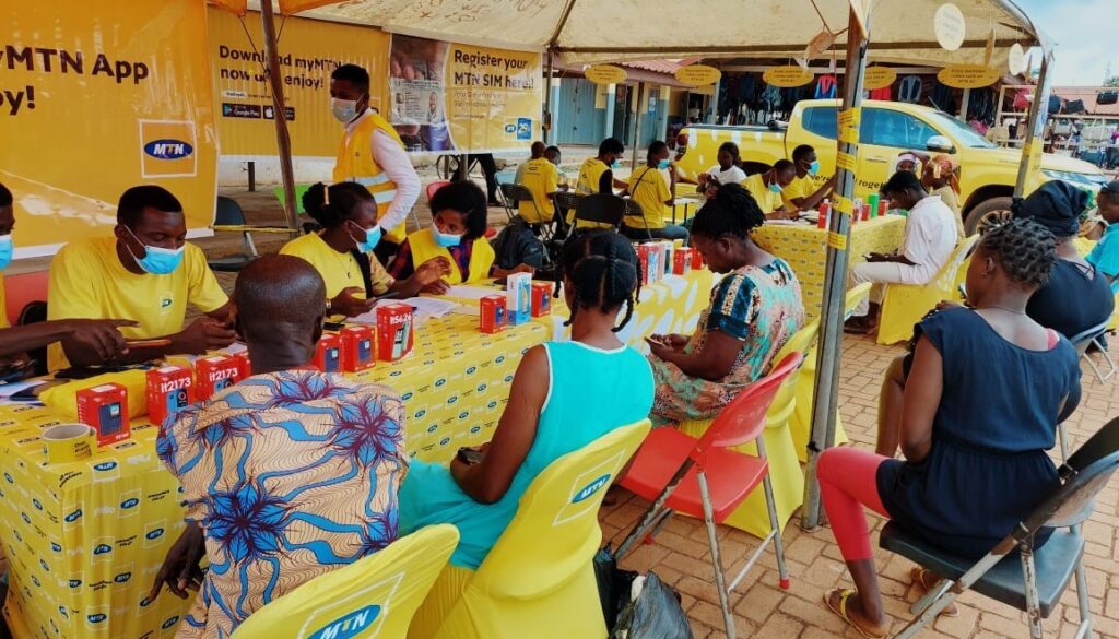 Customers registering their SIM cards at Temporary Registration point at Madina market in Accra