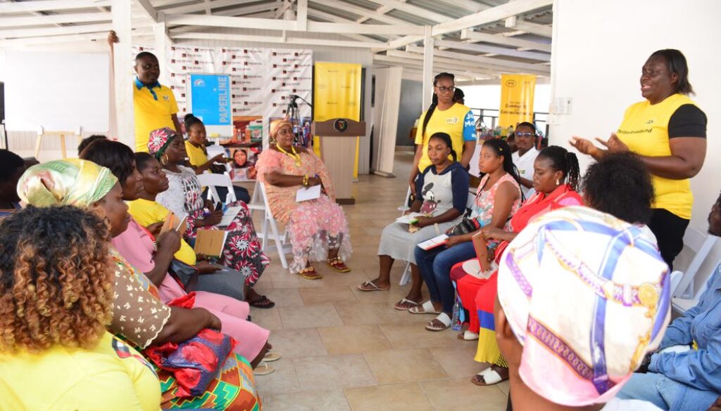 MTN employee volunteers training beneficiaries on customer service and financial literacy skills.jfif