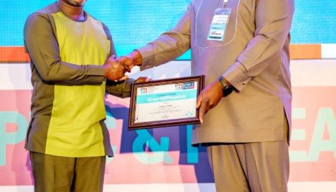 email1723742825866William Tetteh, Chief Capital Projects Officer receiving a certificate of participation at the conference