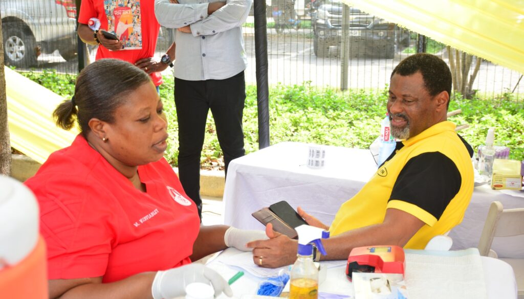 Robert Kuzoe Senior Manager for MTN Ghana Foundation preparing to donate blood during MTN Save a Life Campaign